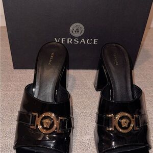 Versace Women's Black and Gold Heeled Mules